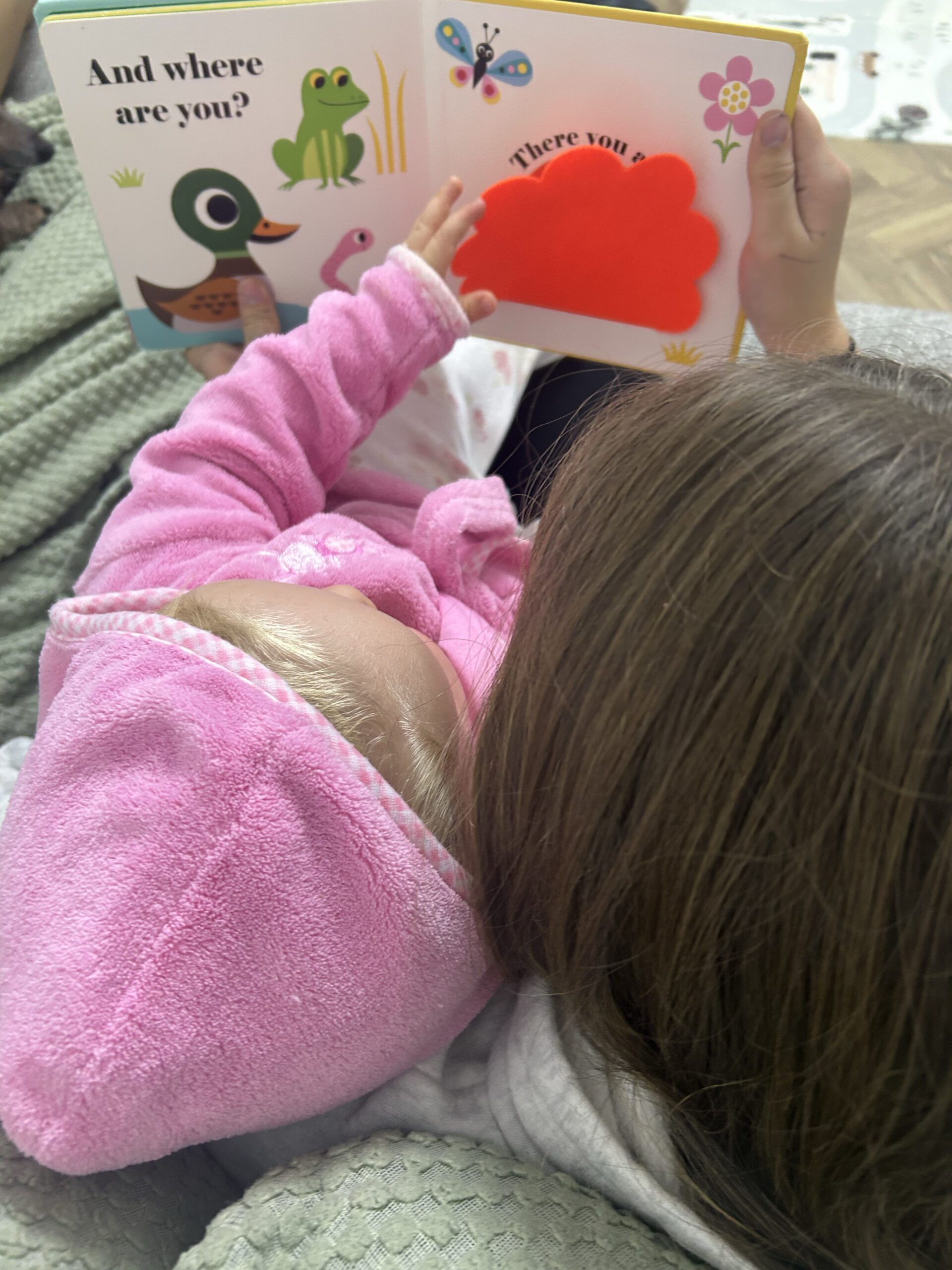 young-girl-reading-a-story-to baby